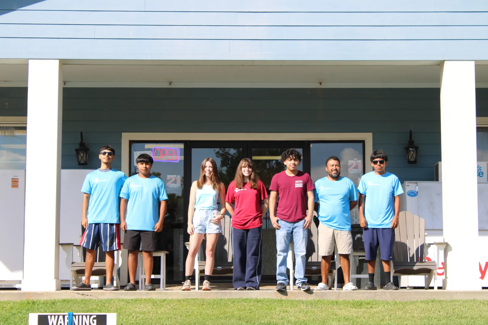 The Palms Marina crew in Palms Marina shirts in front of the ship's store on Lake Conroe