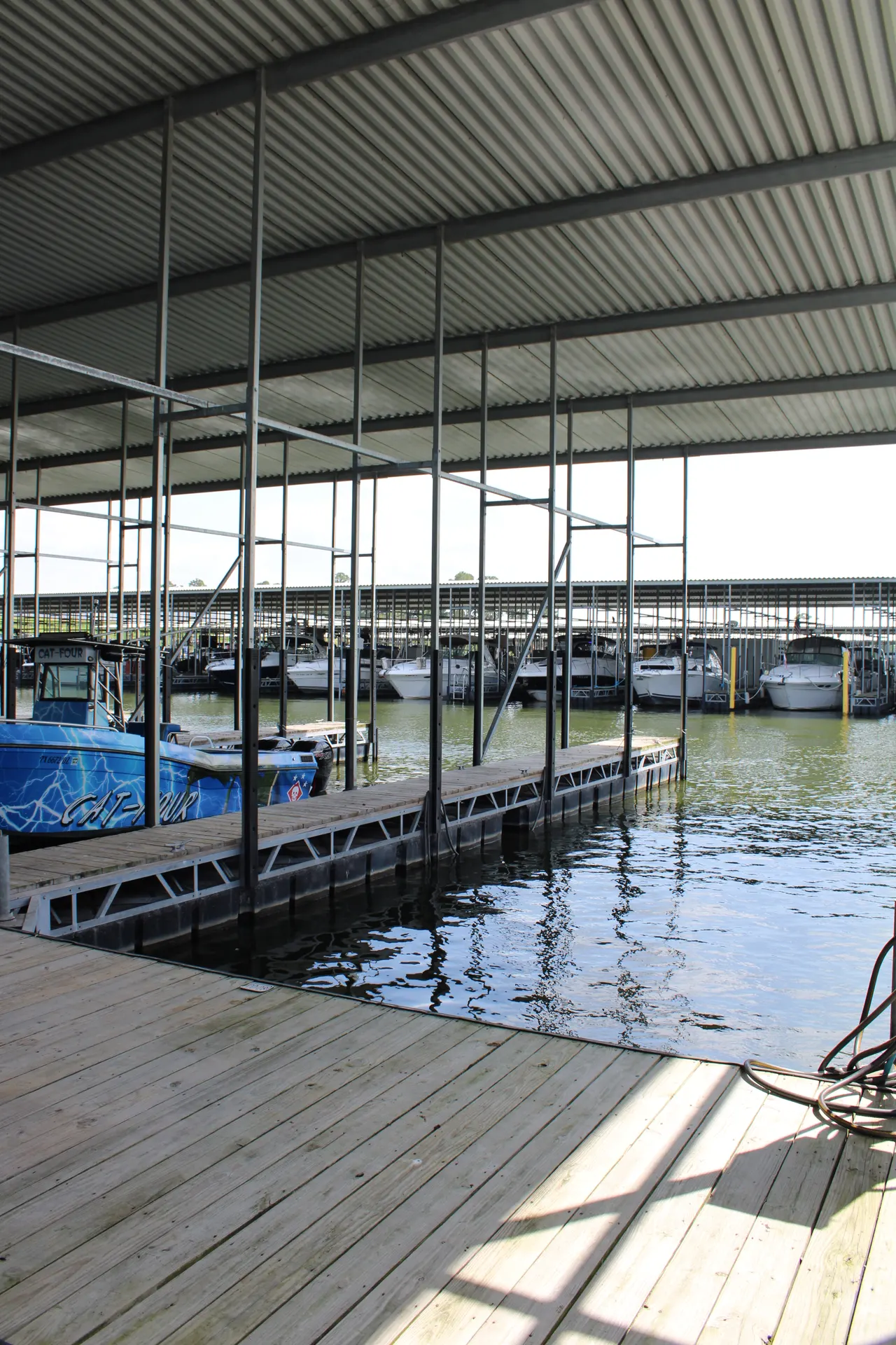 Covered boat slips over Lake Conroe at The Palms Marina