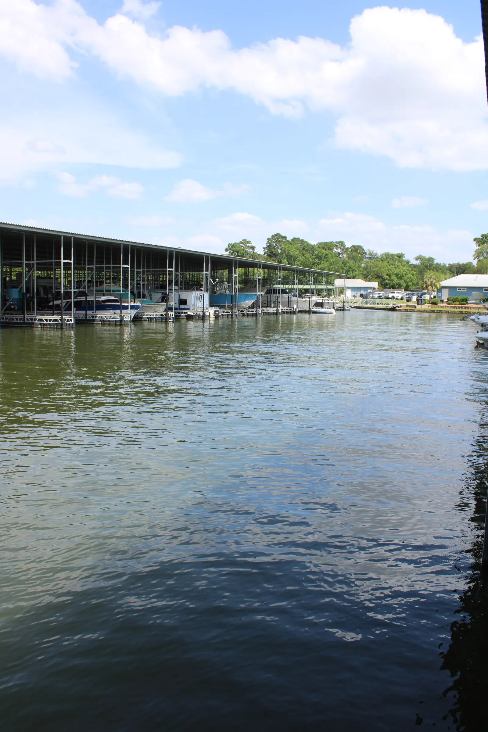 The sunny covered slips of C Dock at The Palms Marina