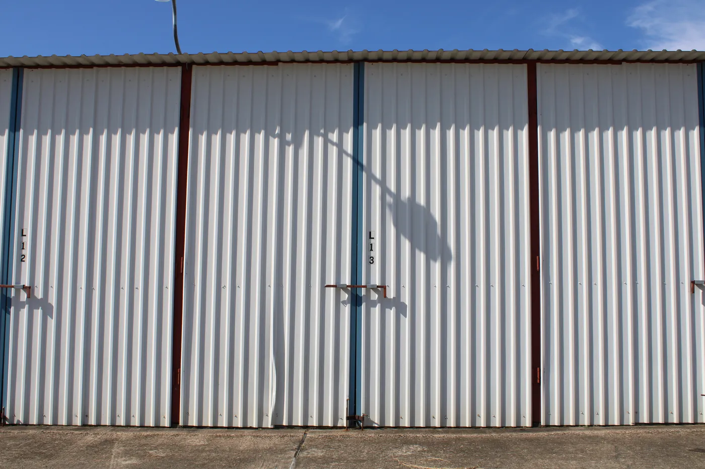 The doors of a 34′ × 12′ enclosed dry storage stall at The Palms Marina