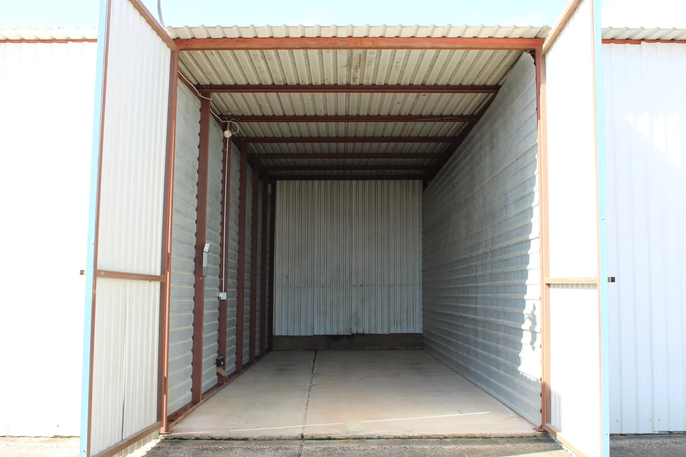 Inside a 34′ × 12′ enclosed dry storage stall at The Palms Marina