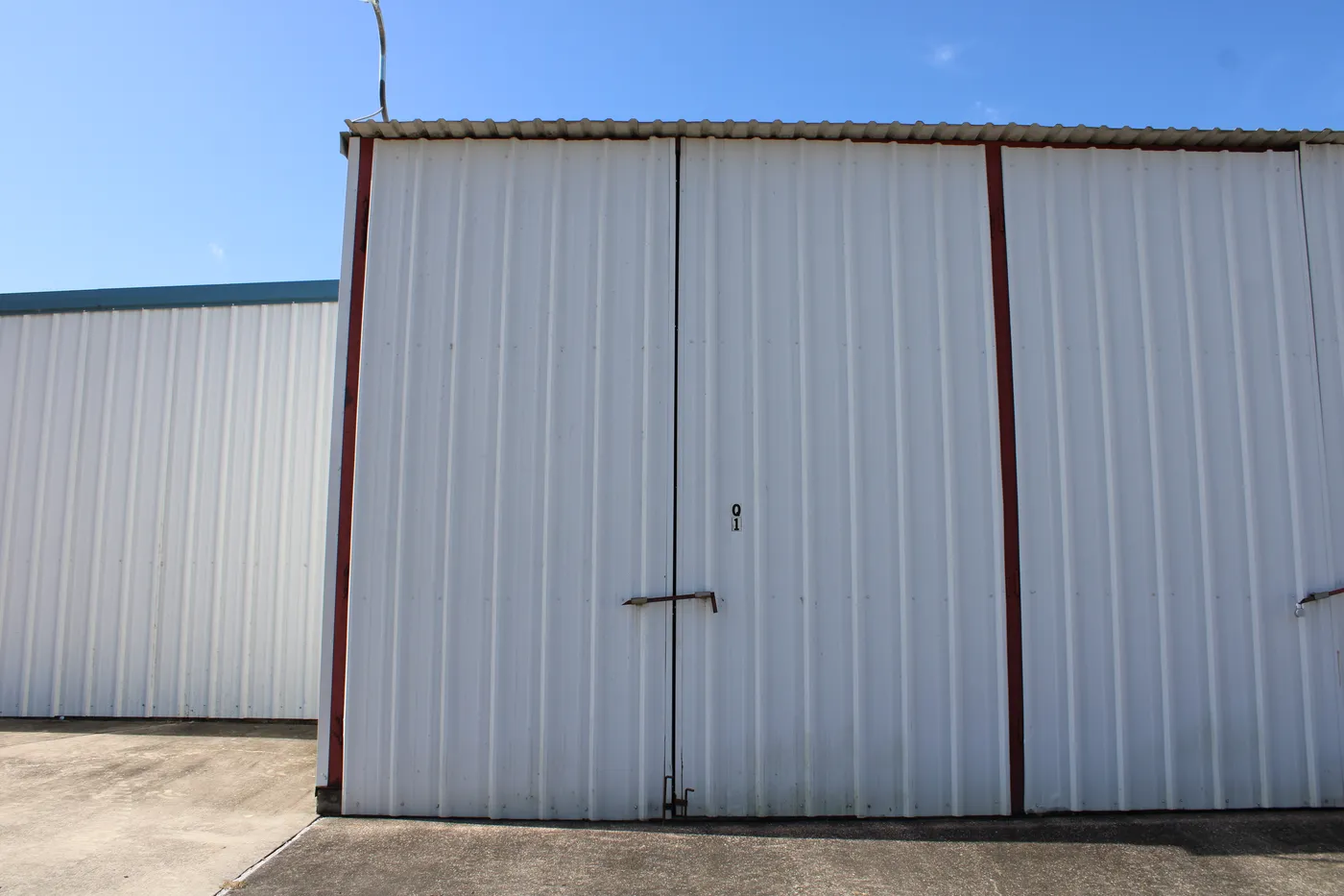 The doors of a 45′ × 14′ enclosed dry storage stall at The Palms Marina