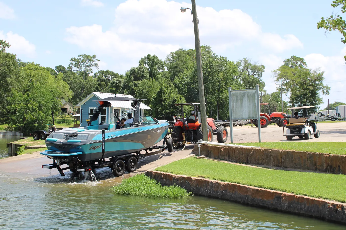 The Palms Marina valet crew backing a boat down the launch ramp